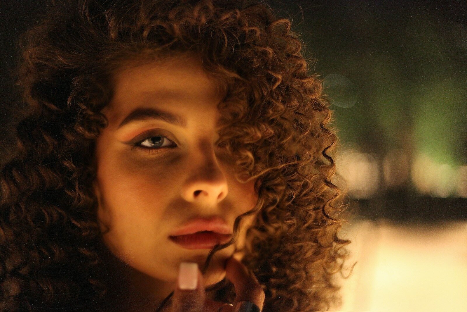 a woman with curly hair